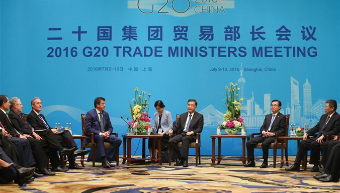 Wang Yang trifft sich mit den ausländischen Vertretern zum Treffen der G20-Handelsminister in Shanghai