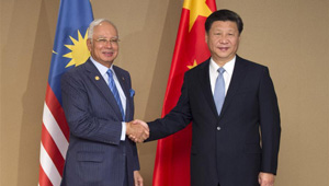 Xi Jinping trifft malaysischen Premier Razak