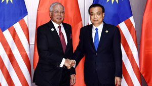 Li Keqiang trifft malaysischen Premierminister in Laos